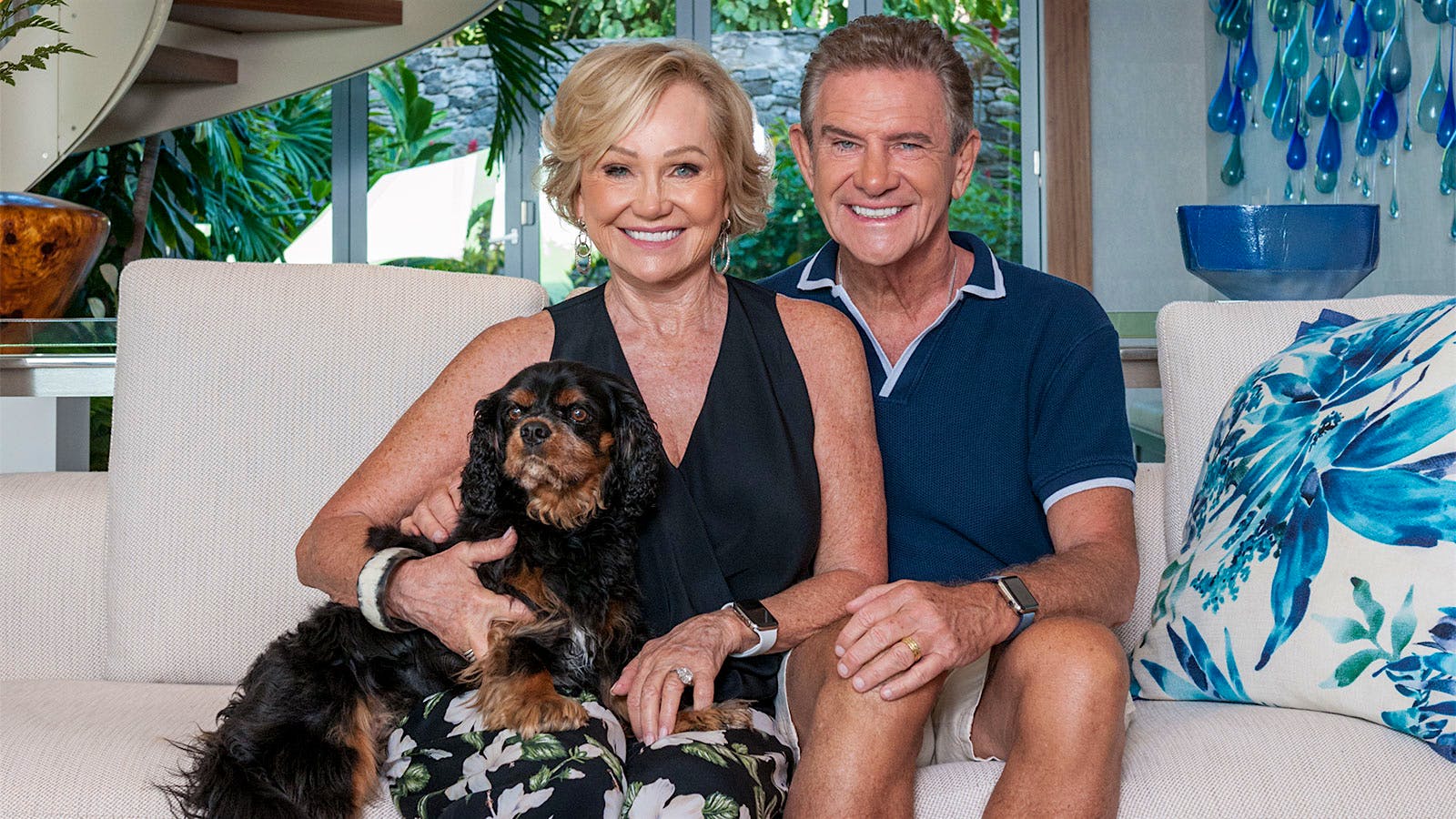 Portrait of Kathryn Walt Hall and Craig Hall with their dog